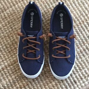 Sperry. Womens 9 1/2 Wide. Navy blue canvas slip on with faux barrel tie laces.